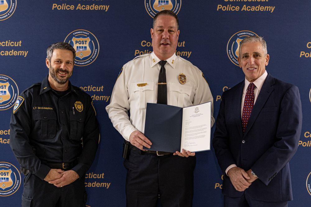 (L to R) Lt. Dan Skoumbros, Chief Jeremiah P Marron Jr., Chief Keith Mello, the Chairman of the Connecticut Police Officers Standards and Training Council. 